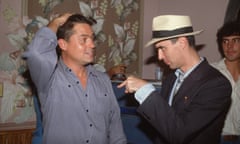 Jonathan Demme and David Byrne<br>(Original Caption) : 1984: A waist-up, candid shot of David Byrne, singer for the pop band The Talking Heads, pointing at Jonathan Demme, the director of The Talking Heads' movie, "Stop Making Sense." Demme holds his hand to his head and falls prey to Byrne's sinister pointing finger. (Photo by Lynn Goldsmith/Corbis/VCG via Getty Images)