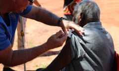 A supplied image of Beagle Bay community member receives a coronavirus vaccine in the remote Aboriginal community of Beagle Bay in the Kimberley region, WA, Tuesday, March 30, 2021. Beagle Bay is the first remote community in WA to receive the vaccines. Tuesday, March 30, 2021, (AAP Image/Supplied by Kimberley Aboriginal Medical Services) NO ARCHIVING, EDITORIAL USE ONLY