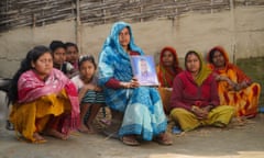 Laduwati Yadav with a photo of her husband, Gangaram Mandal, who died in Qatar