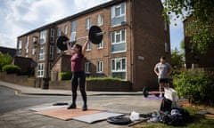 The CrossFit enthusiast Elena Demou and her personal trainer, James Luong, work out by the side of the road in London