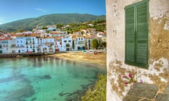 Window detail with beach and whitewashed buildings of Cadaques, Spain in background.<br>A69NHA Window detail with beach and whitewashed buildings of Cadaques, Spain in background.