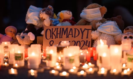 Lit candles, pet stuffed animals, and a sign that reads ‘Okhmatdyt 08.07.2024’ in Warsaw, Poland, on 8 July 2024