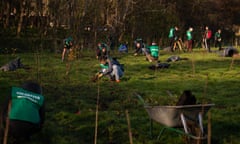 Jessica Murray wrote a piece on Trees for Cities, one of the charities the Guardian is raising money for as part of this year’s charity appeal. Volunteers organised a tree-planting event on Saturday (30th Nov) at Beckton District Park South. In the image the atmosphere of the event and people planting trees. Photograph: Alecsandra Raluca Dragoi for the Guardian