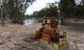 A rusted water pump in bushland