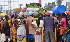 Marketeers gather around a car, at one of the largest food markets in Monrovia,  that has just arrived with foodstuff for sale from the interior of the country at the city of Monrovia, Liberia, Friday, Aug. 15, 2014. The World Food Program says 1 million people in Guinea, Liberia and Sierra Leone may need food assistance in the coming months, as measures to slow Ebola s spread have caused price hikes and slowed the flow of goods to isolated areas. (AP Photo/Abbas Dulleh)