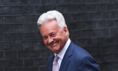 Grey-haired man in close-up smiles