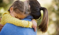 Hispanic woman carrying daughter<br>GettyImages-90306700