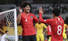 Kim Min-jae celebrates after scoring for South Korea against China in December 2019