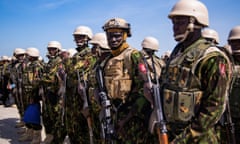 Police from Kenya stand on the tarmac of the Toussaint Louverture International Airport after landing in Port-au-Prince, Haiti, Tuesday, June 25, 2024. The first U.N.-backed contingent of foreign police arrived nearly two years after the Caribbean country requested help to quell a surge in gang violence. (AP Photo/Marckinson Pierre)