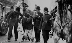 A demonstrator is arrested during hours of running fights in October 1936