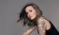 Portrait of Victoria Pendleton showing large tattoos on her upper arms and shoulders.