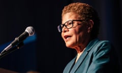 A Black woman speaks into a microphone