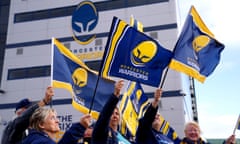Worcester Warriors fans wave flags outside of Sixways Stadium