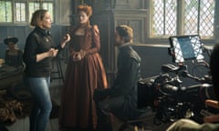 Director Josie Rourke and actors Margot Robbie and Joe Alwyn on the set of Mary Queen of Scots.