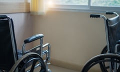 Empty wheelchairs parked in hospital.