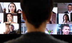 Woman watching video conference with multiple screens