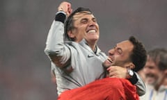 The Turkey head coach, Vincenzo Montella, celebrates with Hakan Calhanoglu