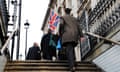 People going to work in traditional clothing, who may be civil servants, Whitehall, London.