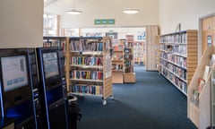 A small village branch library with self-service checkouts.