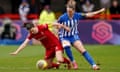 Liverpool's Niamh Fahey (left) and Brighton's Elisabeth Terland battle for the ball in February 2024