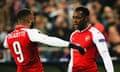 Danny Welbeck celebrates with team-mate Alexandre Lacazette after scoring a vital away goal.