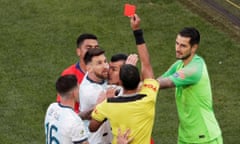 Chile’s Gary Medel and Argentina’s Lionel Messi are both shown the red card by the referee Mario Díaz de Vivar