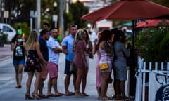 US-HEALTH-VIRUS-EPIDEMIC-LEISURE<br>People stand in queue to enter a restaurant on Ocean Drive in Miami Beach, Florida on June 26, 2020. - They are itching for a good time after months of lockdown, and may the coronavirus be damned: young adults in Florida are fueling a dangerous rise in COVID-19 infections. Feeling immortal, these fun-crazed people are finding ways to gather and party even though many bars and nightclubs remain closed as the Sunshine State reopened its economy this month. (Photo by CHANDAN KHANNA / AFP) (Photo by CHANDAN KHANNA/AFP via Getty Images)