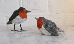 Two ornamental robins carved from limewood and painted