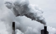 Smoke comes out of a chimney stack at a steelworks