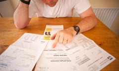 A man worrying over his household bills in the UK