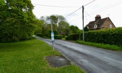 Deserted rural bus stop on a rainy day in the Oxfordshire countryside