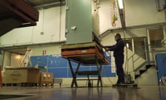 A factory worker checks an industrial refrigeration unit at the Angelantoni Life Science (ALS) factory in Massa Martana, Italy