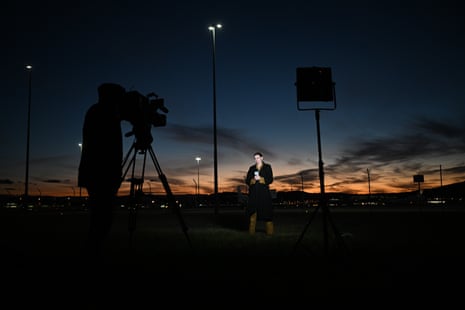Members of the media during a live cross while waiting for the arrival of Julian Assange at Fairbairn airbase in Canberra, Australia