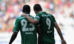 Edin Dzeko of Wolfsburg celebrates scoring his goal with Grafite during the Bundesliga match against 1899 Hoffenheim in May 2009.