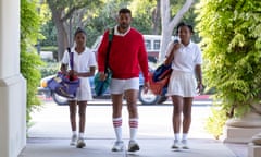 Will Smith, centre, with Demi Singleton, left, and Saniyya Sidney in King Richard.