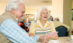 Two residents in a retirement home playing cards<br>A7J8BJ Two residents in a retirement home playing cards