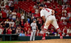 Albert Pujols pitches against the San Francisco Giants during the ninth inning at Busch Stadium