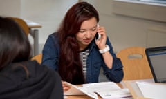 student on phone, reading exam results