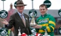 Jockey Paul Townend and trainer Willie Mullins with the winners trophy after victory with I Am Maximus in the 2024 Grand National.