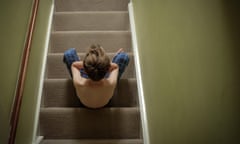 A child sitting on the stairs with his head in his hands looking upset. Image shot 06/2015. Exact date unknown.<br>EWDB2A A child sitting on the stairs with his head in his hands looking upset. Image shot 06/2015. Exact date unknown.