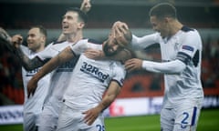 Kemar Roofe celebrates with teammates after his spectacular goal, hit from the halfway line, capped a 2-0 Europa League win for Rangers at Standard Liège