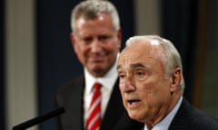 The New York City police commissioner, Bill Bratton, address the media on Tuesday, watched by Mayor Bill de Blasio.