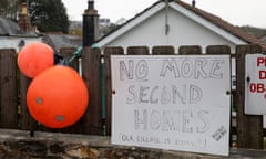 A sign saying 'No more second homes' in St Agnes, Cornwall.