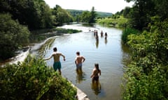 People in the water at Warleigh Weir near Bath