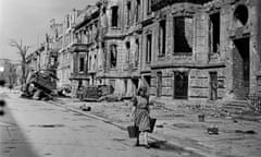 Bomb Damage In Berlin<br>A young woman carries a bucket aas she walks along a street of bomb-damaged buildings, Berlin, Germany, 1945. (Photo by William Vandivert/Time &amp; Life Pictures/Getty Images)