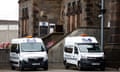 Two Prison Service vans parked outside the front entrance of HMP Wandsworth