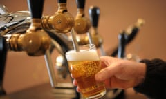 A beer is poured into a glass.