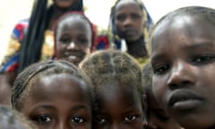 Children of Nigerian refugees stand at a Chadian camp after fleeing Boko Haram.