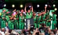 Anya Shrubsole lifts the women’s Hundred trophy surrounded by her Southern Brave teammates at Lord’s