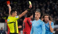 Referee Marco di Bello shows a red card to Lazio's Matteo Guendouzi and a yellow card to Milan's Christian Pulisic.